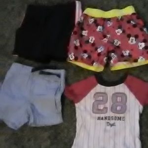 little boys shorts and baseball shirt
